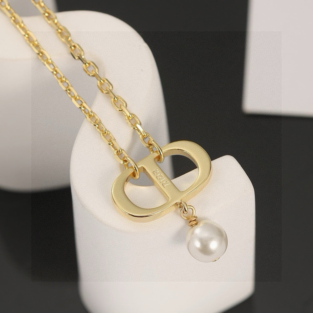 Martin Graham pendant necklace in polished metal-tone – detail view