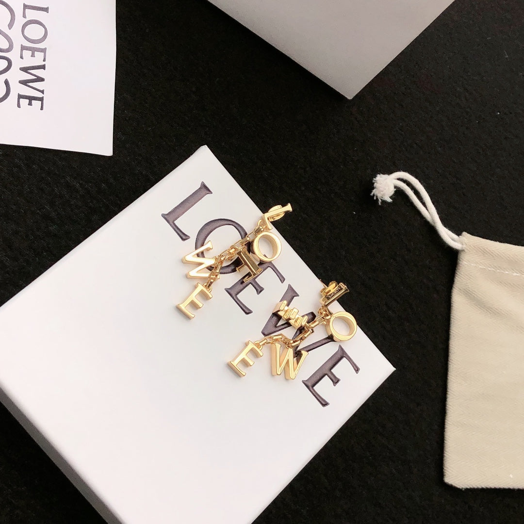 Martin Graham stud earrings in polished metal-tone – detail view