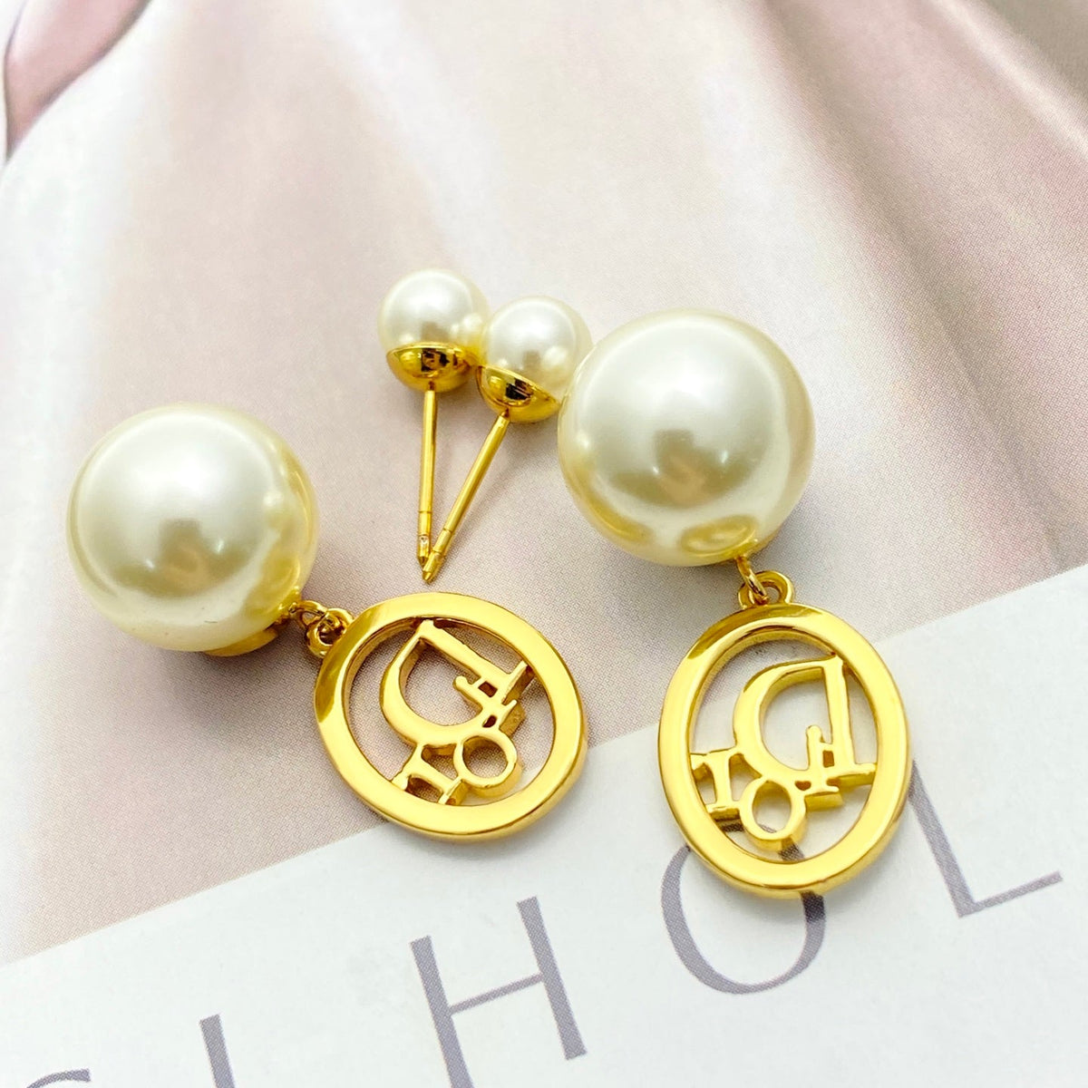 Martin Graham stud earrings in polished metal-tone – detail view