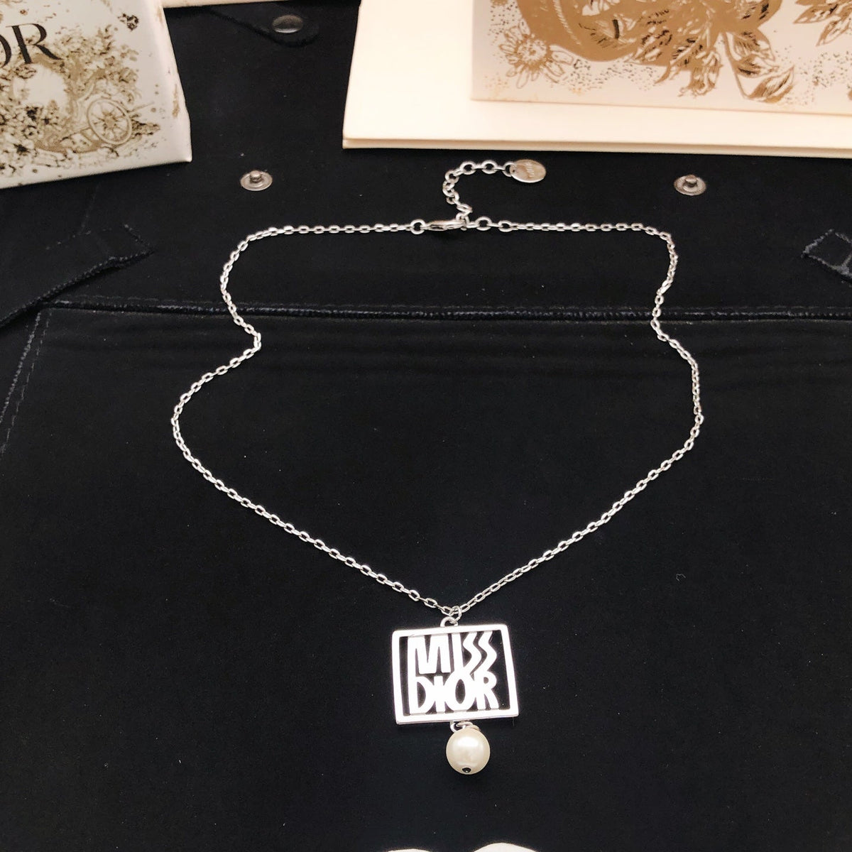 Martin Graham pendant necklace in polished metal-tone – detail view