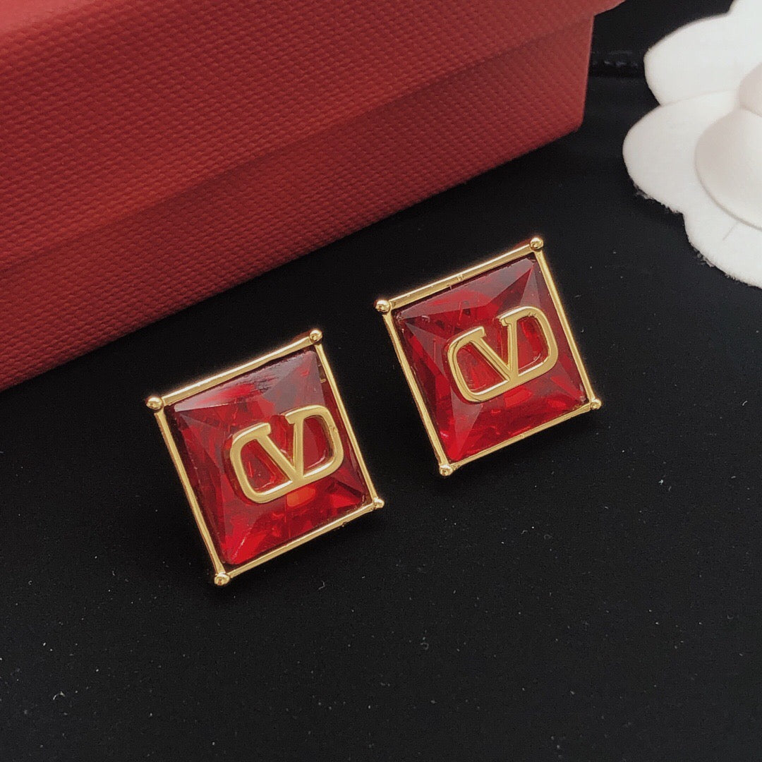 Martin Graham stud earrings in polished metal-tone – detail view