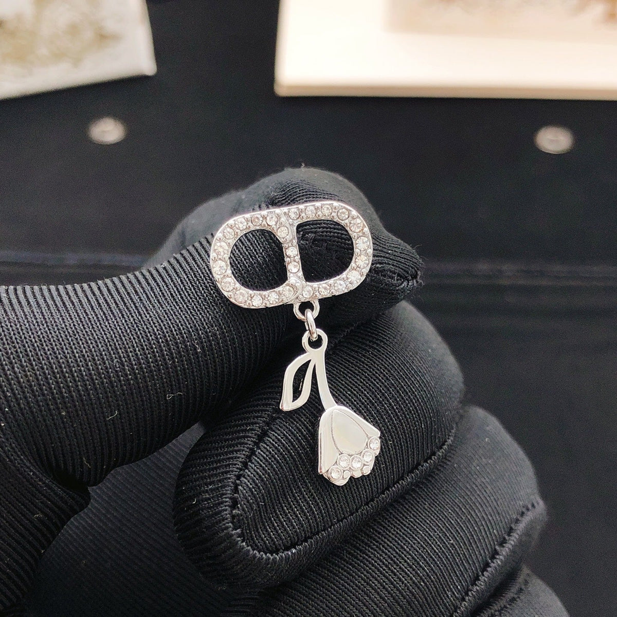 Martin Graham stud earrings in polished metal-tone – detail view