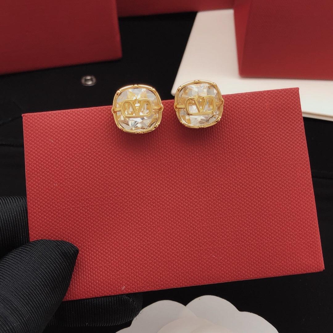 Martin Graham stud earrings in polished metal-tone – detail view