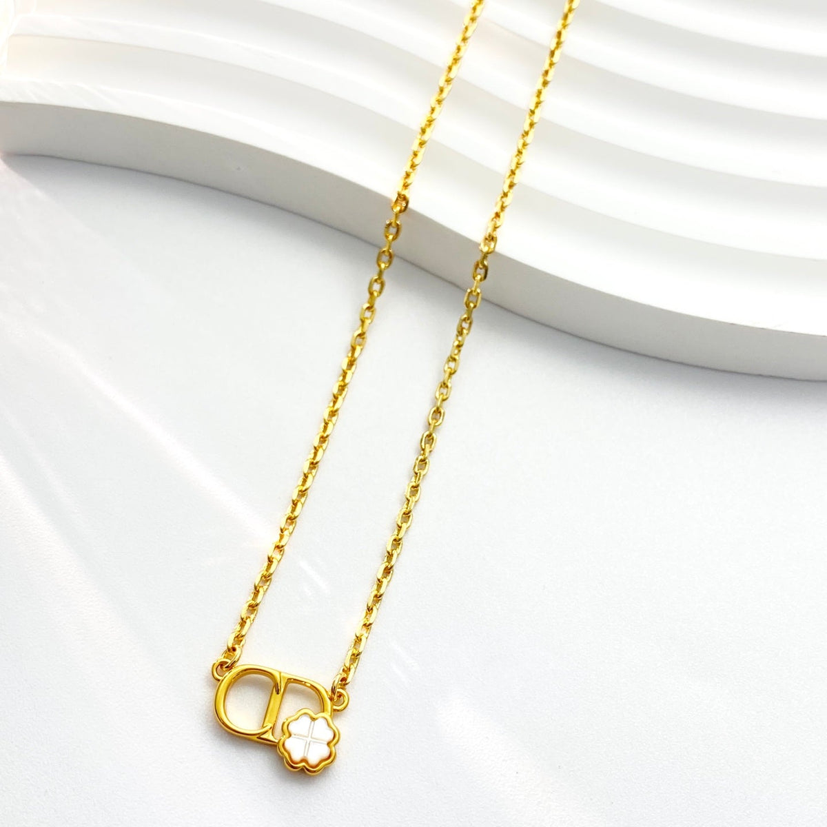 Martin Graham pendant necklace in polished metal-tone – detail view