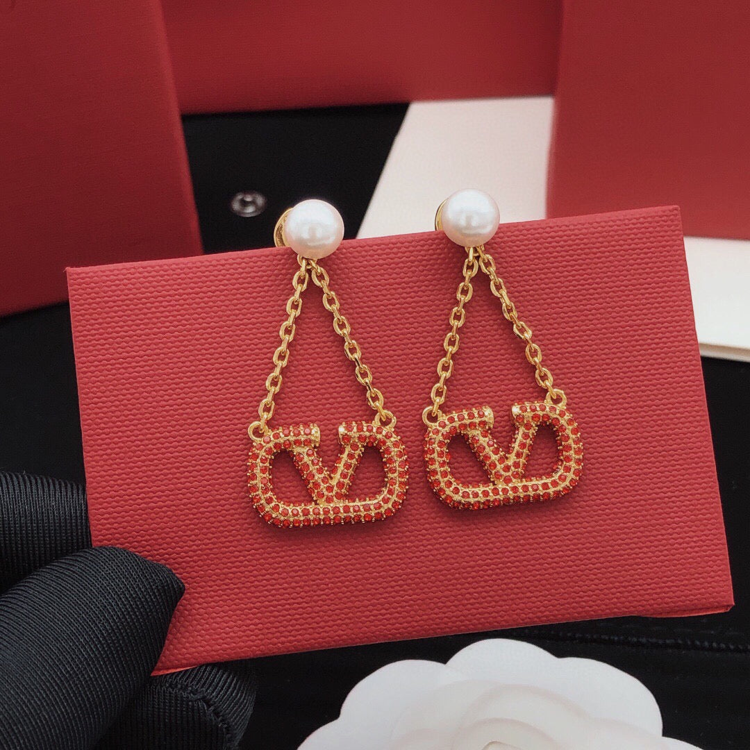 Martin Graham stud earrings in polished metal-tone – detail view