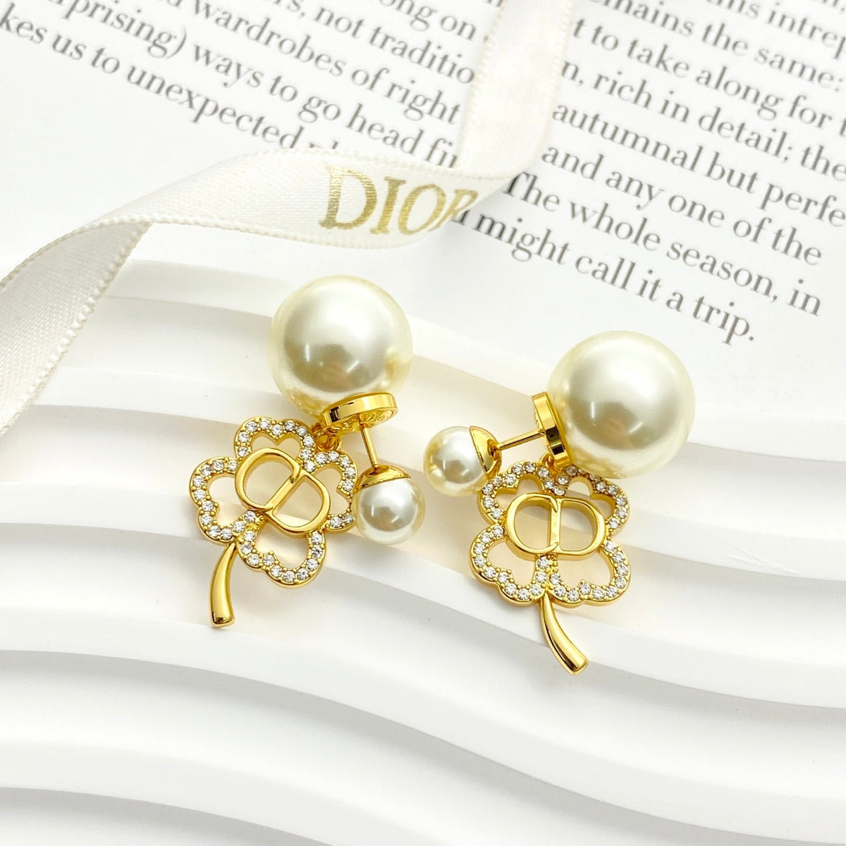 Martin Graham stud earrings in polished metal-tone – detail view
