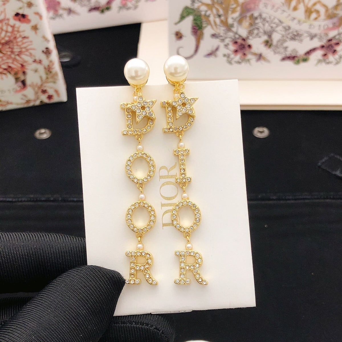Martin Graham stud earrings in polished metal-tone – detail view
