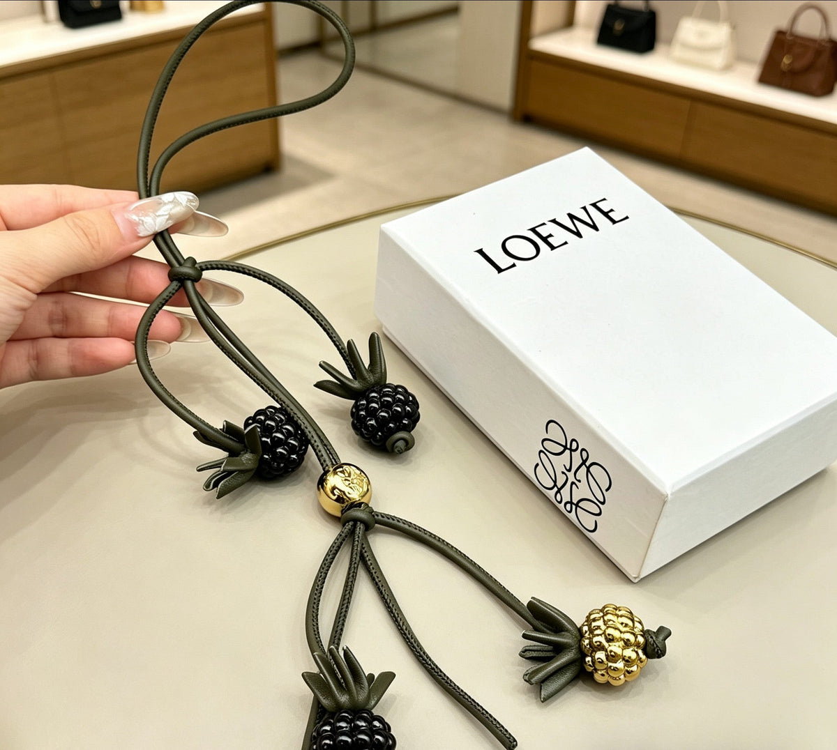 Martin Graham bag charm in polished metal-tone – detail view