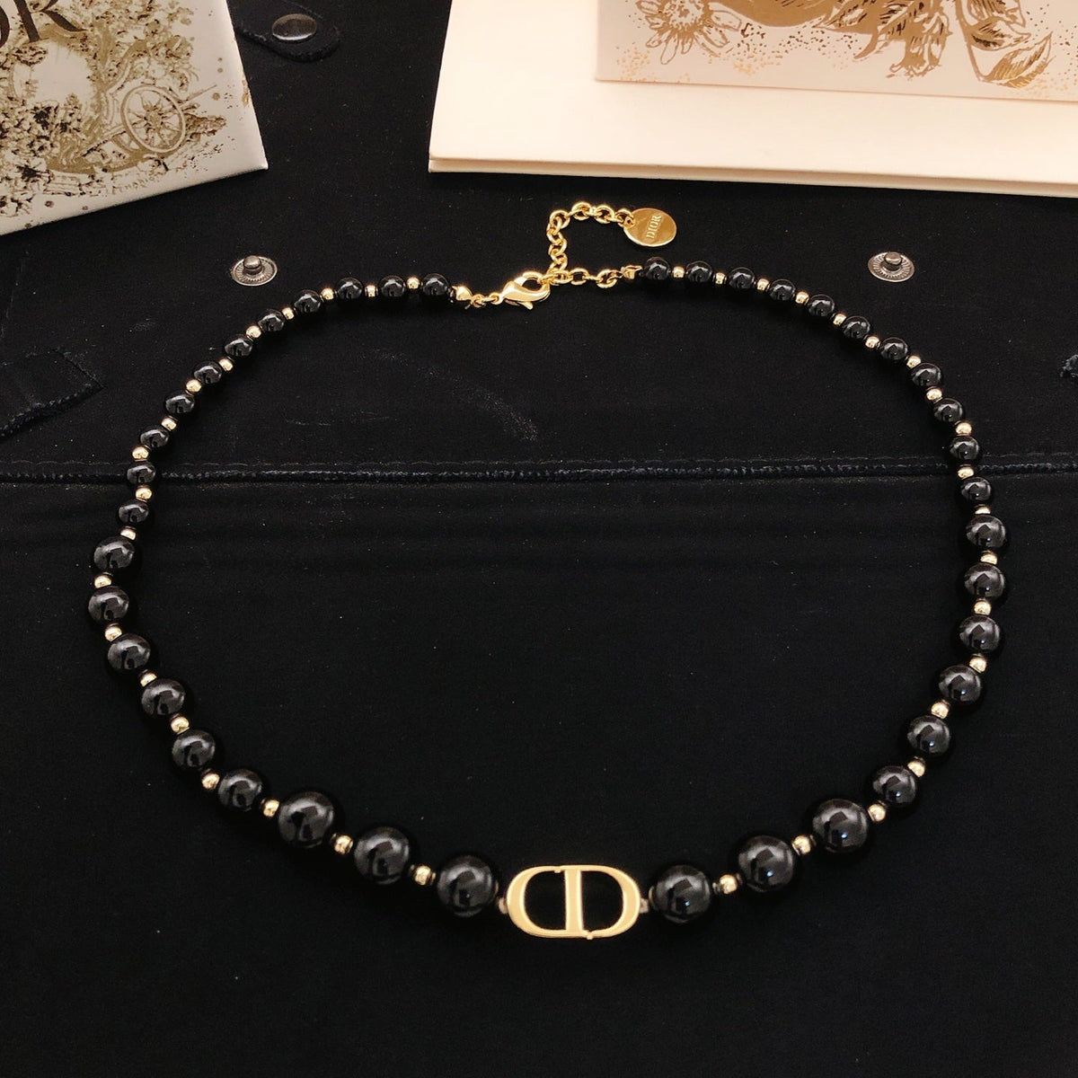 Martin Graham pendant necklace in polished metal-tone – detail view