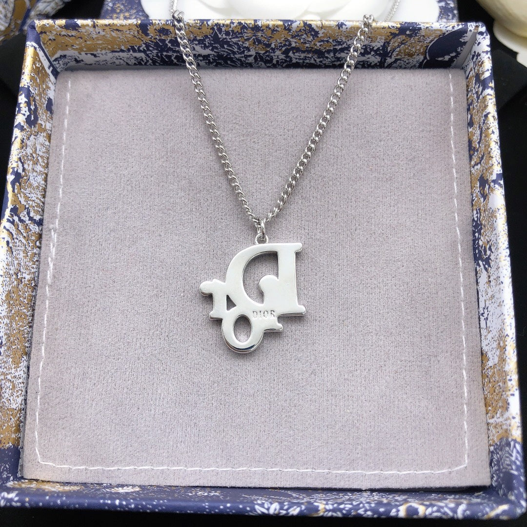 Martin Graham pendant necklace in polished metal-tone – detail view