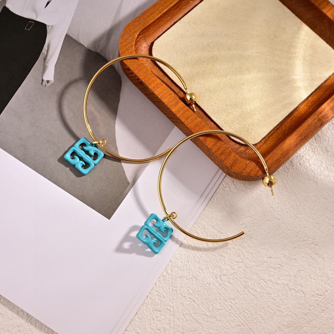 Martin Graham earrings in polished metal-tone