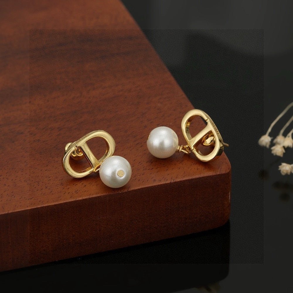 Martin Graham stud earrings in polished metal-tone – detail view