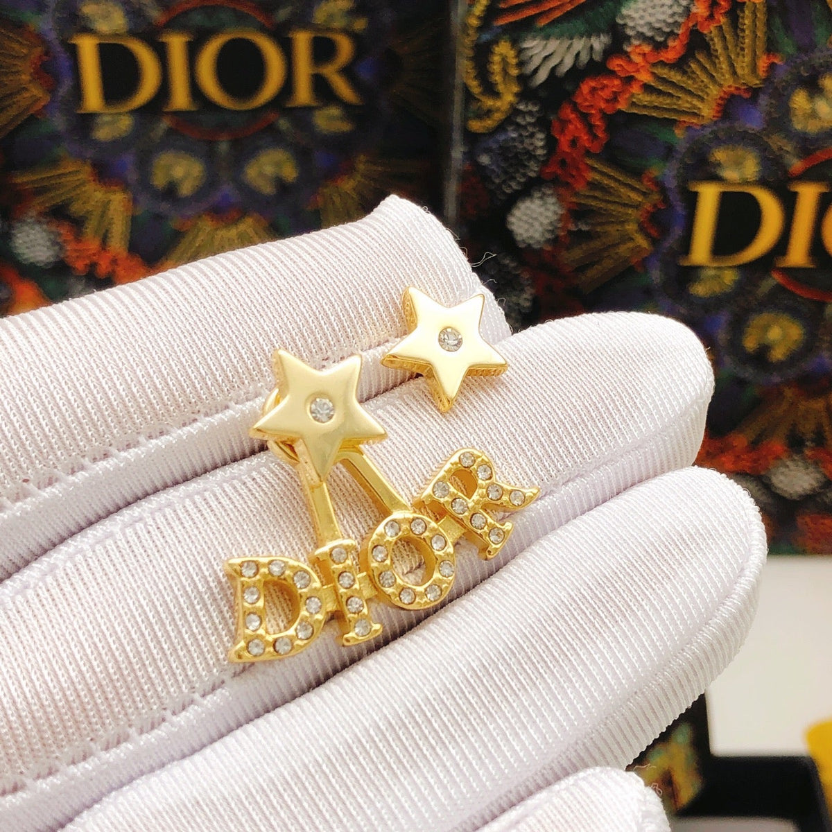 Martin Graham stud earrings in polished metal-tone – detail view