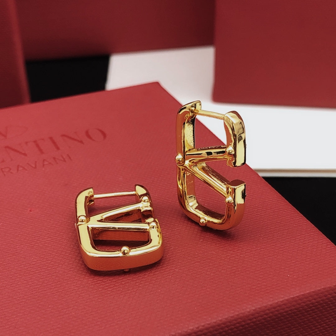 Martin Graham drop earrings in polished metal-tone – detail view
