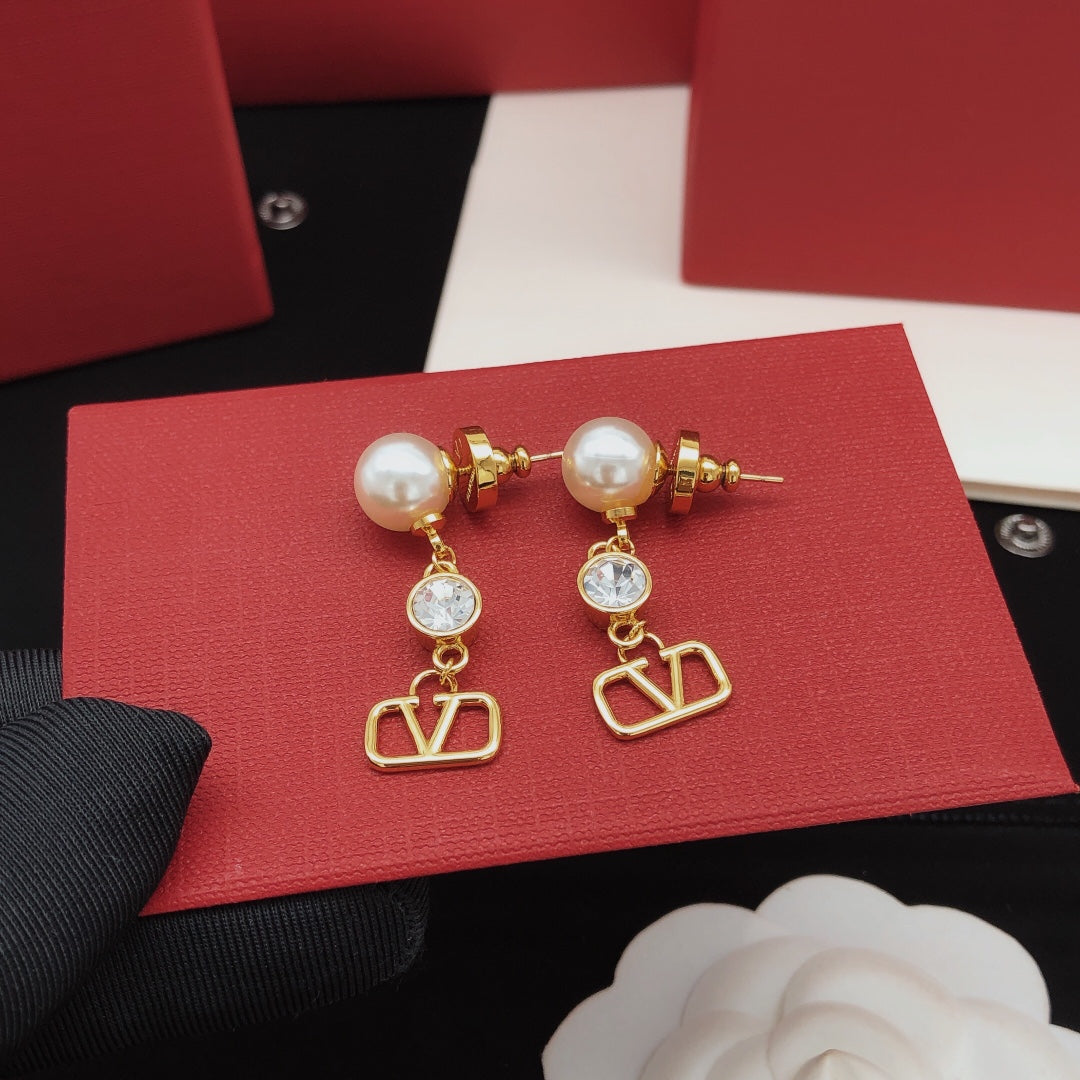 Martin Graham stud earrings in polished metal-tone – detail view