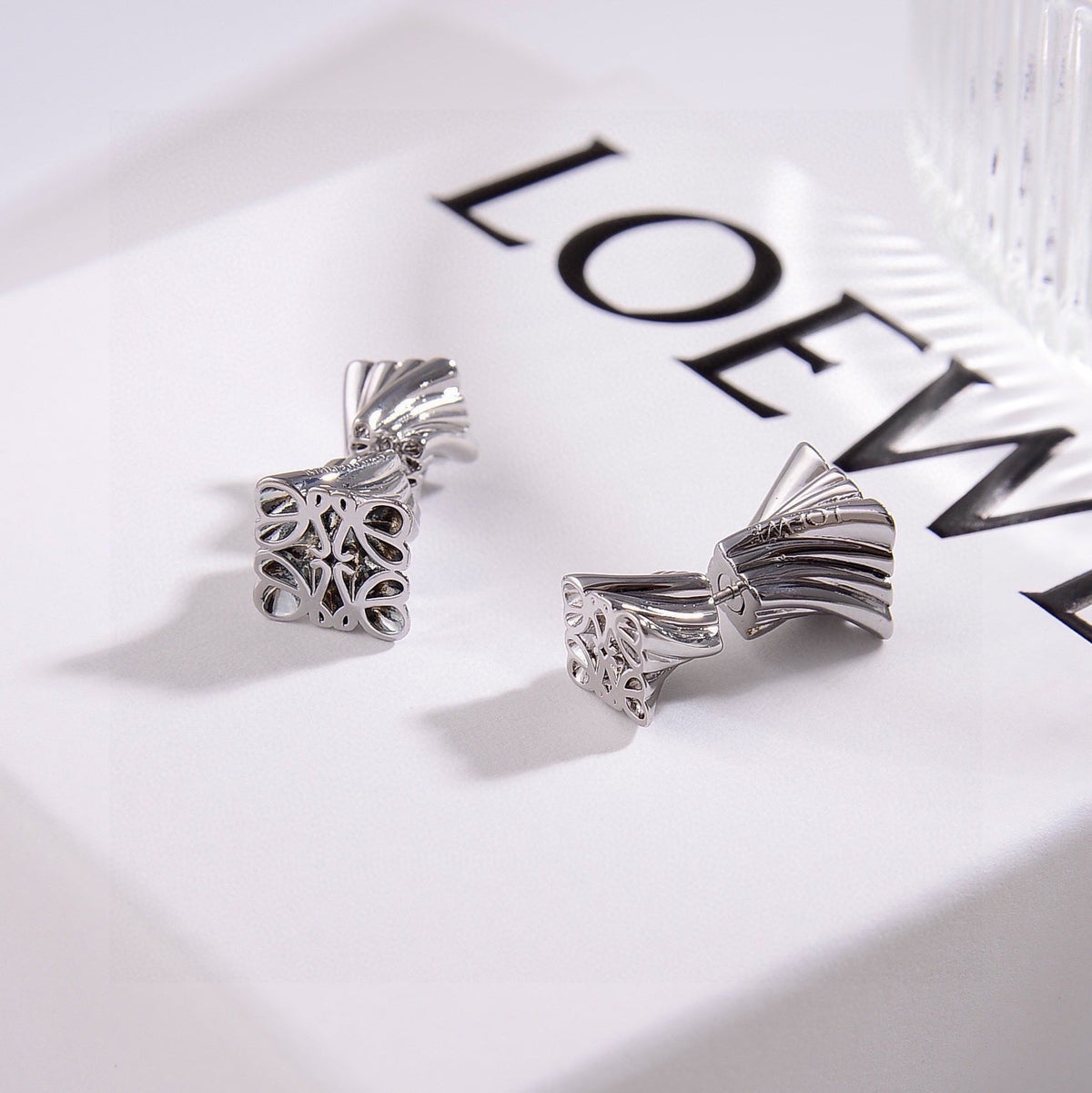 Martin Graham stud earrings in polished metal-tone – detail view