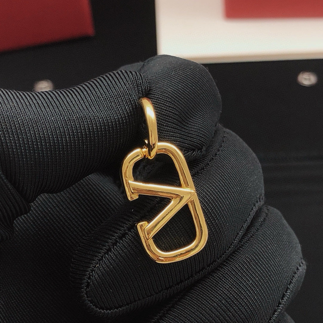 Martin Graham drop earrings in polished metal-tone – detail view