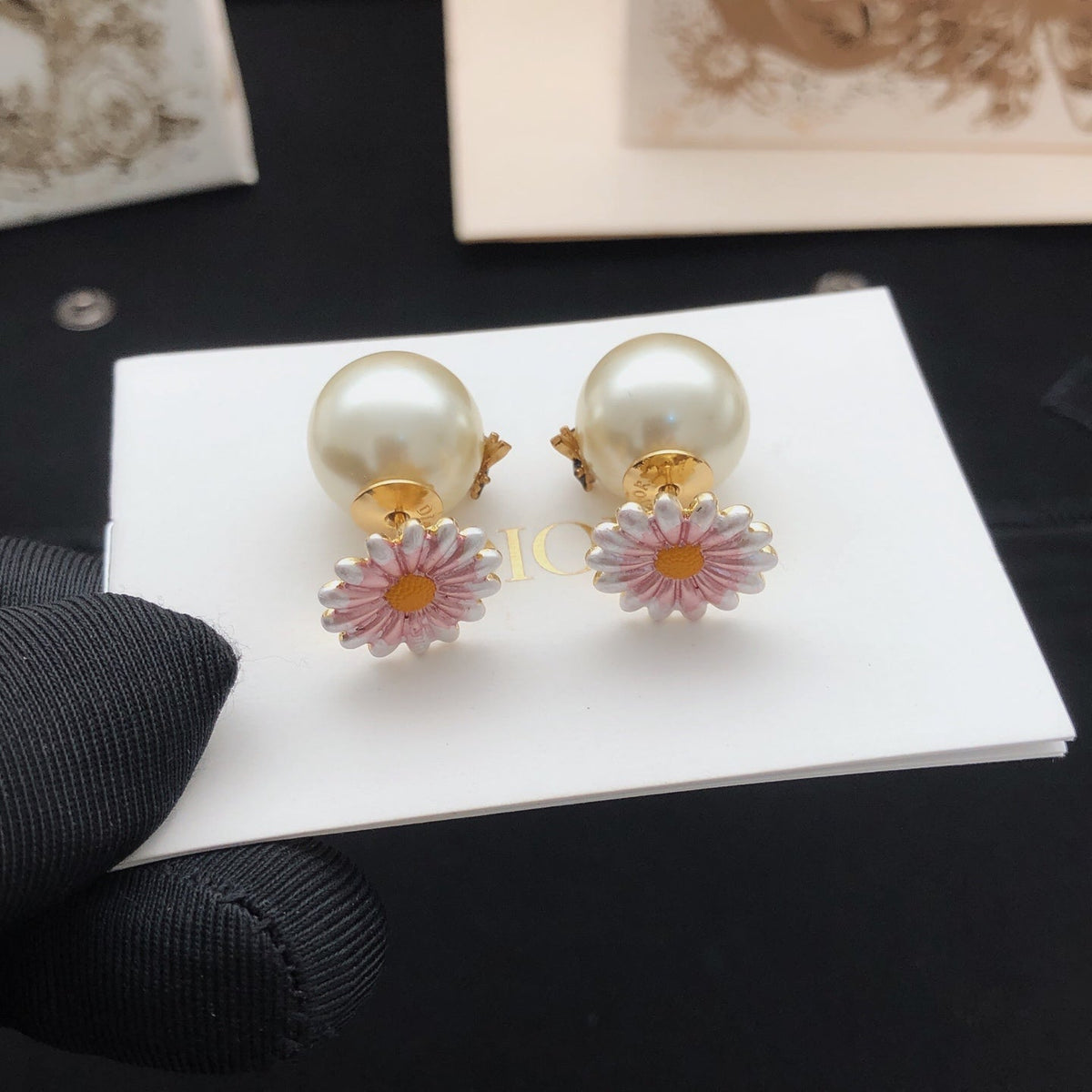 Martin Graham stud earrings in polished metal-tone – detail view