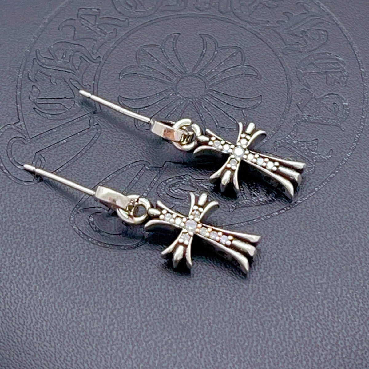 Martin Graham stud earrings in polished metal-tone – detail view
