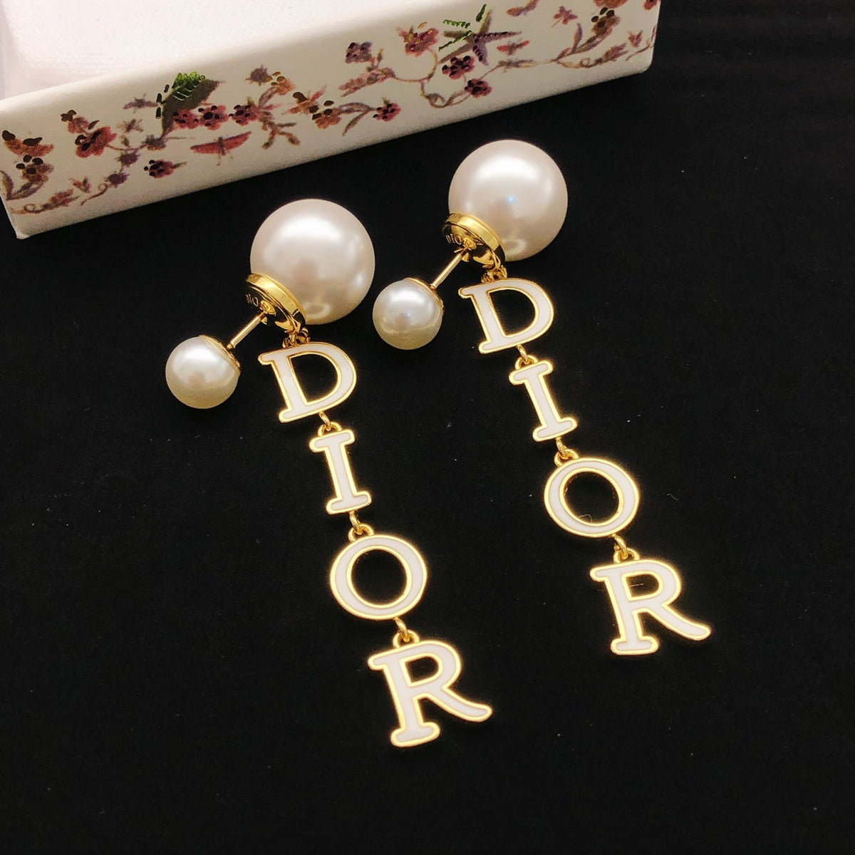 Martin Graham stud earrings in polished metal-tone – detail view