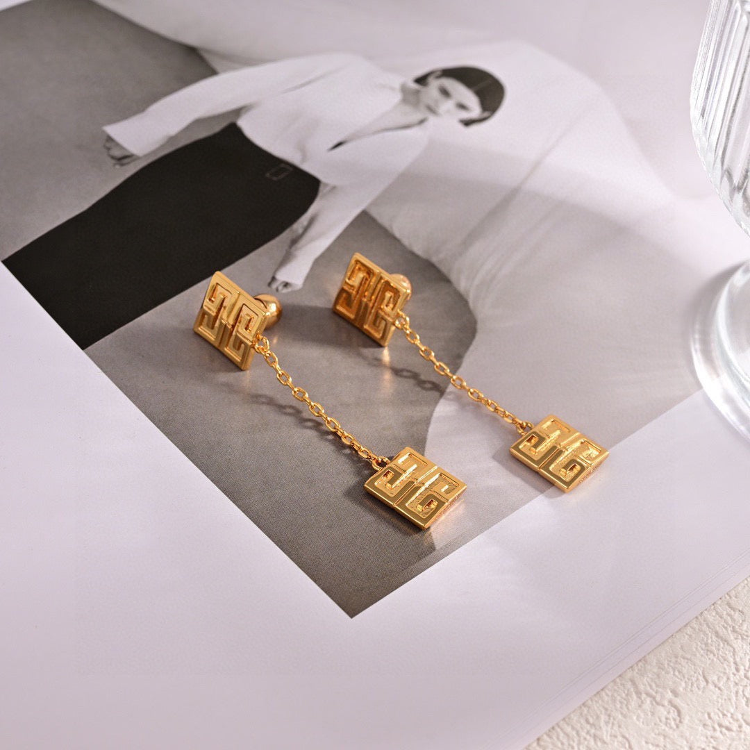 Martin Graham stud earrings in polished metal-tone – detail view