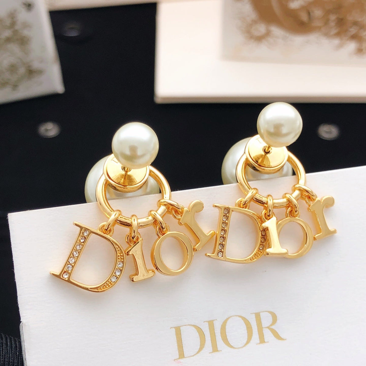 Martin Graham stud earrings in polished metal-tone – side detail