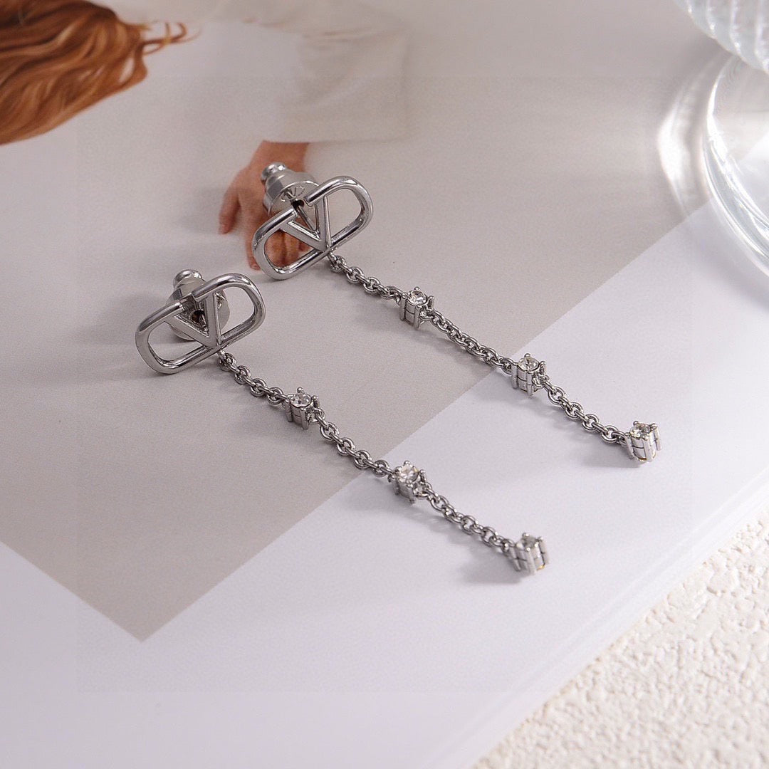 Martin Graham stud earrings in polished metal-tone – side detail