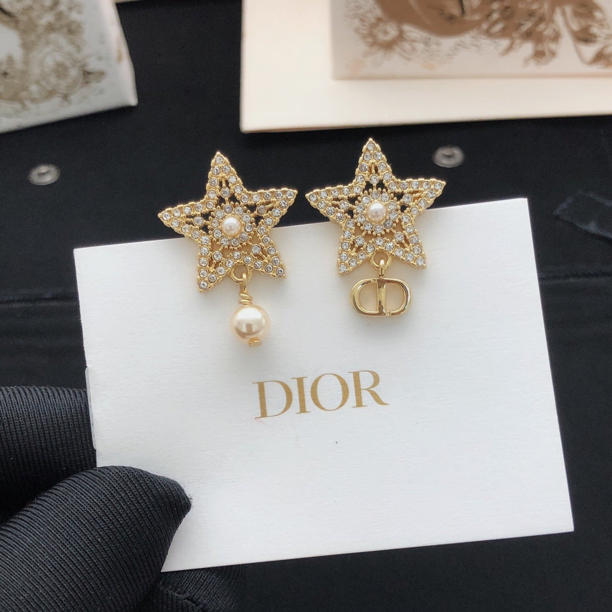 Martin Graham stud earrings in polished metal-tone – side detail