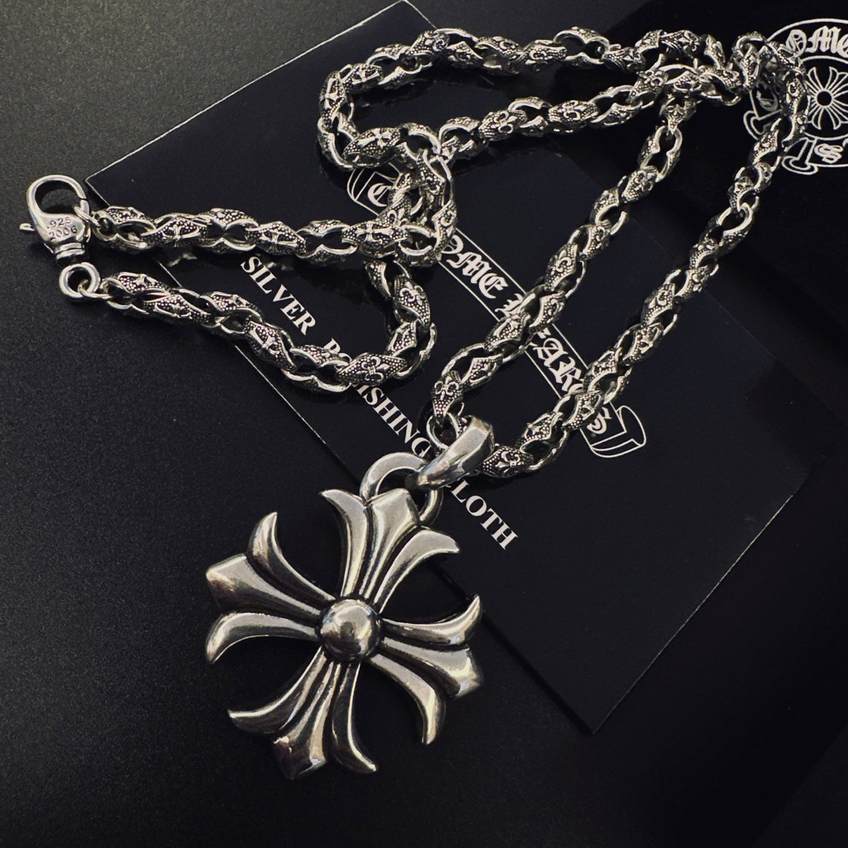 Martin Graham pendant necklace in polished metal-tone – side detail
