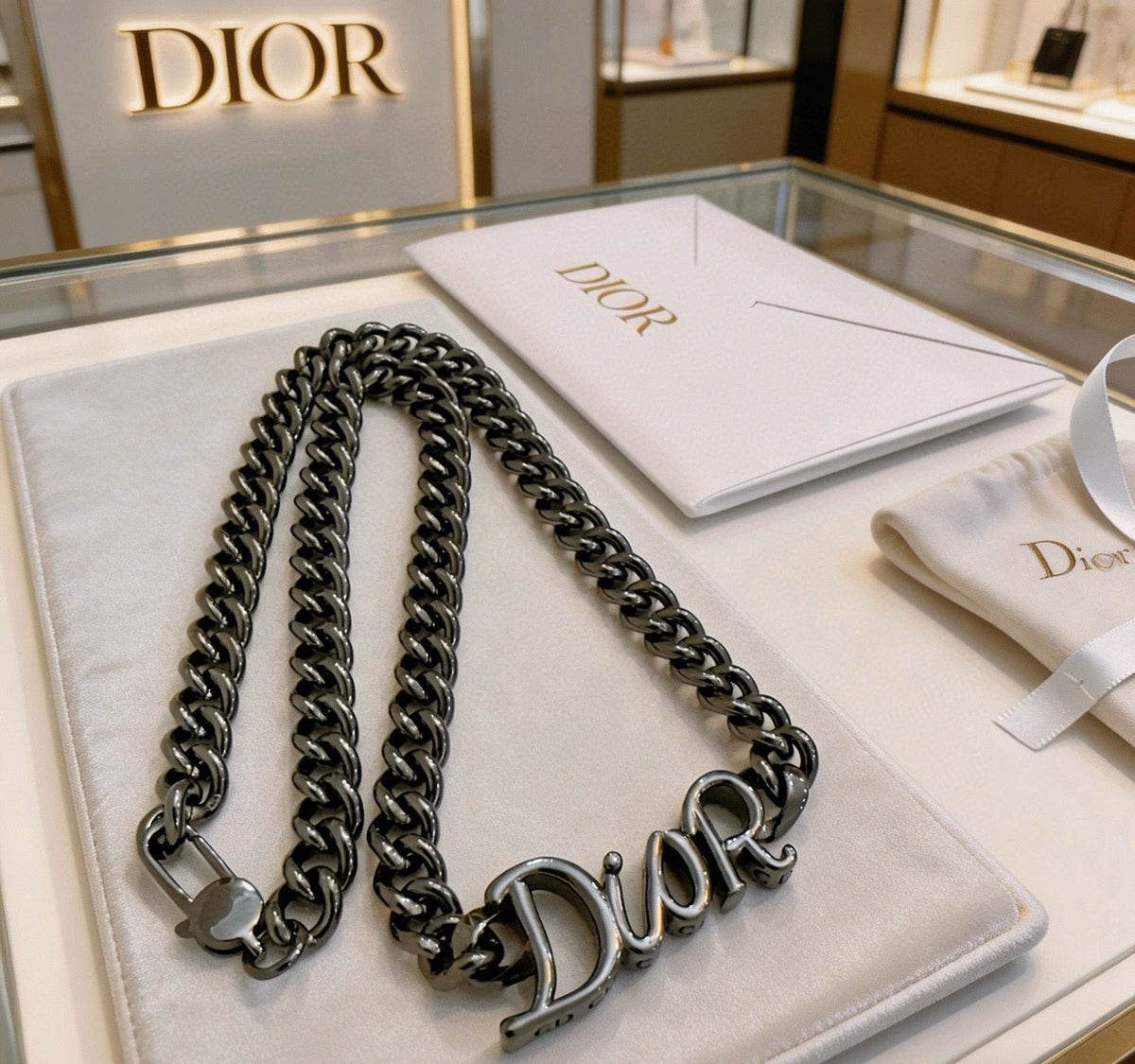 Martin Graham pendant necklace in polished metal-tone – side detail