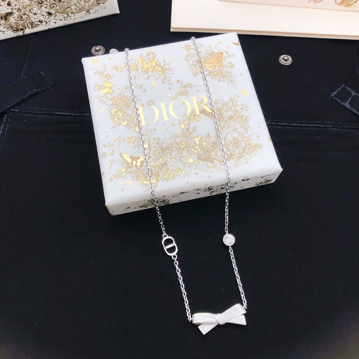 Martin Graham pendant necklace in polished metal-tone – side detail