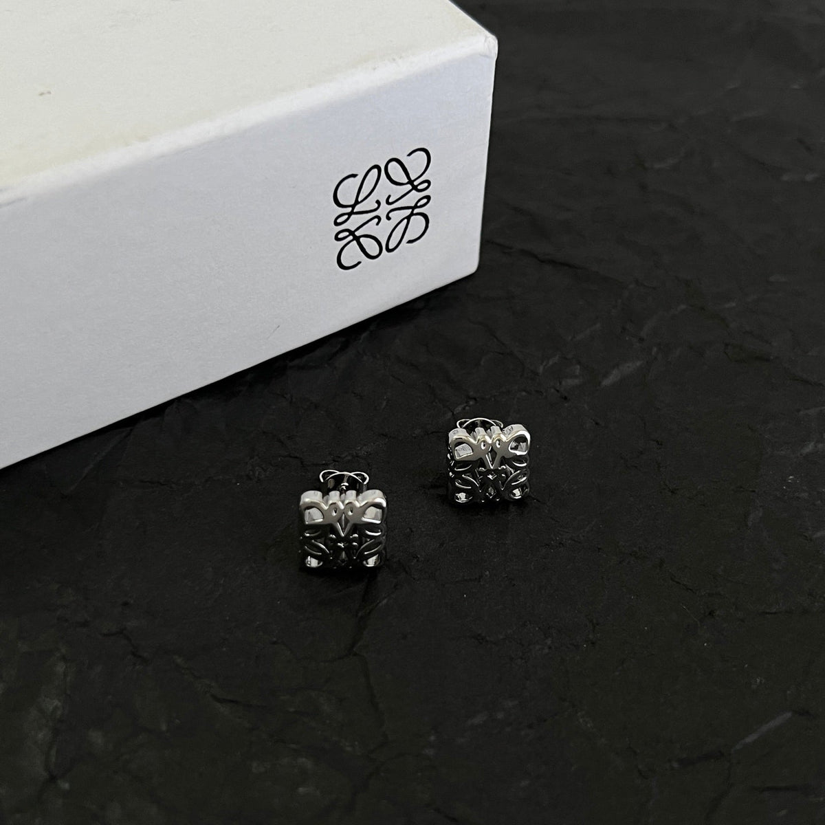 Martin Graham stud earrings in polished metal-tone – side detail