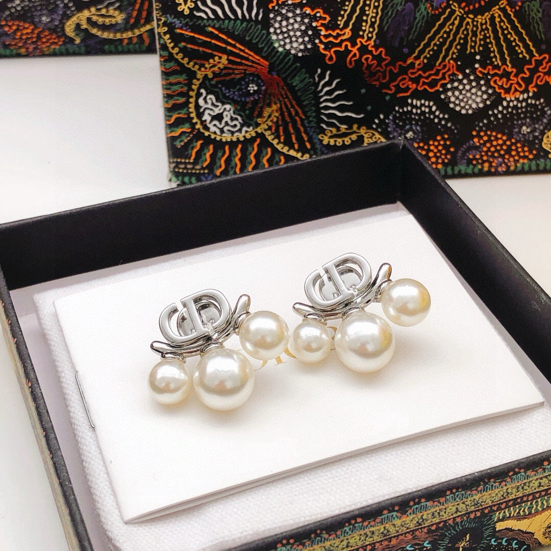 Martin Graham stud earrings in polished metal-tone – side detail