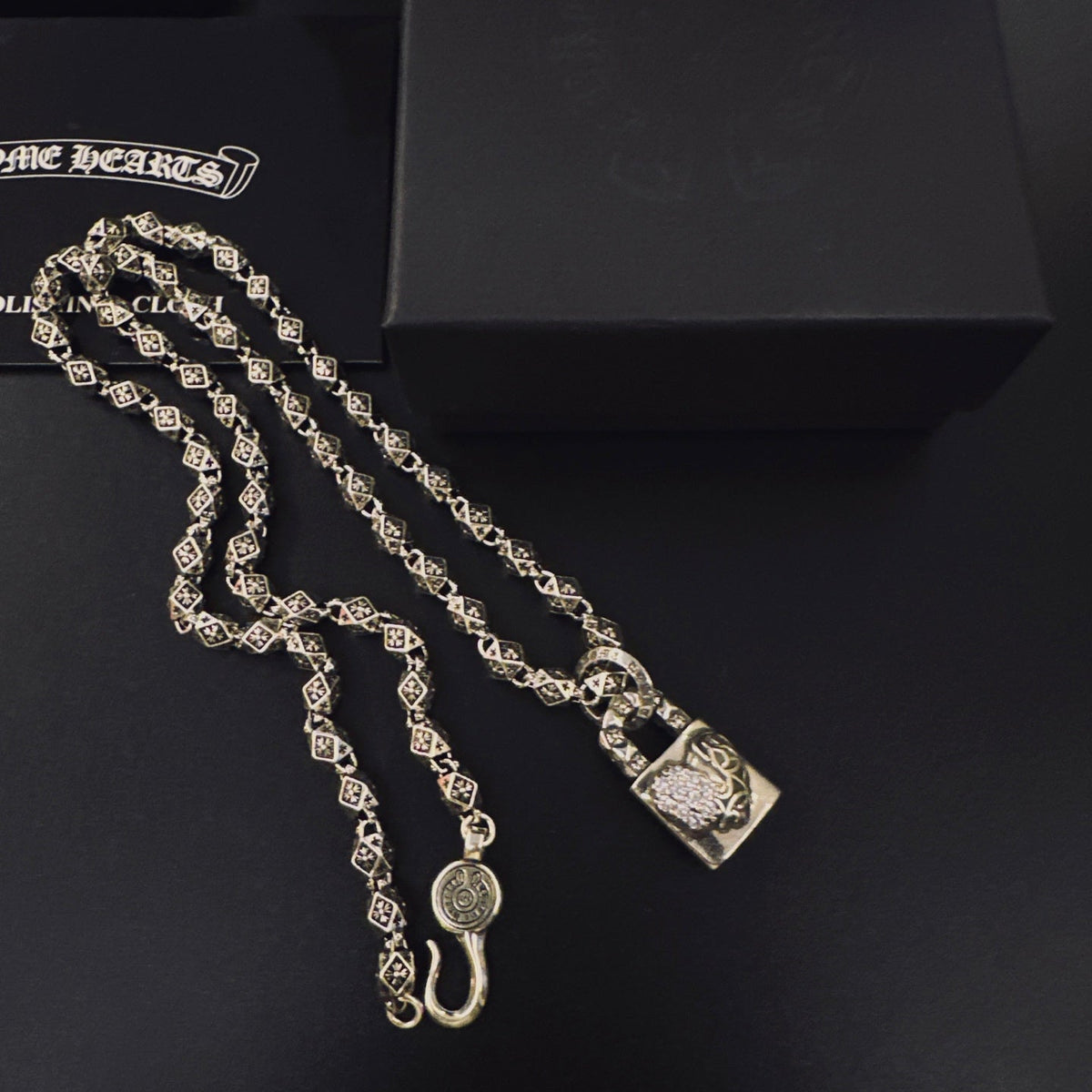 Martin Graham pendant necklace in polished metal-tone – side detail