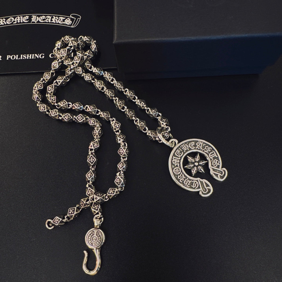 Martin Graham pendant necklace in polished metal-tone – side detail