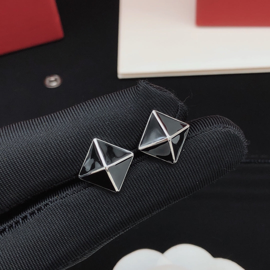 Martin Graham stud earrings in polished metal-tone – side detail