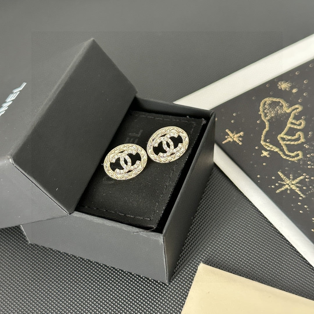 Martin Graham stud earrings in polished metal-tone – side detail