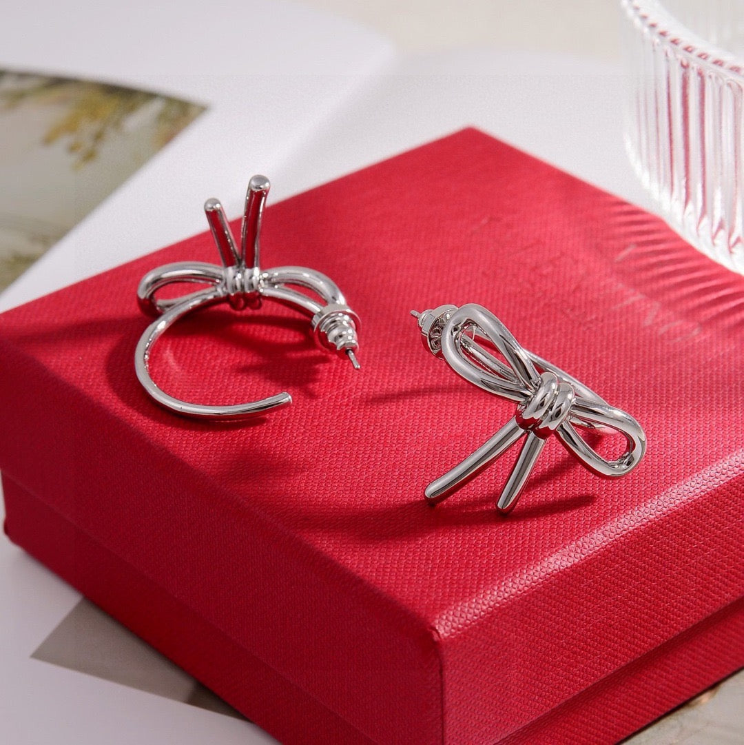 Martin Graham stud earrings in polished metal-tone – side detail