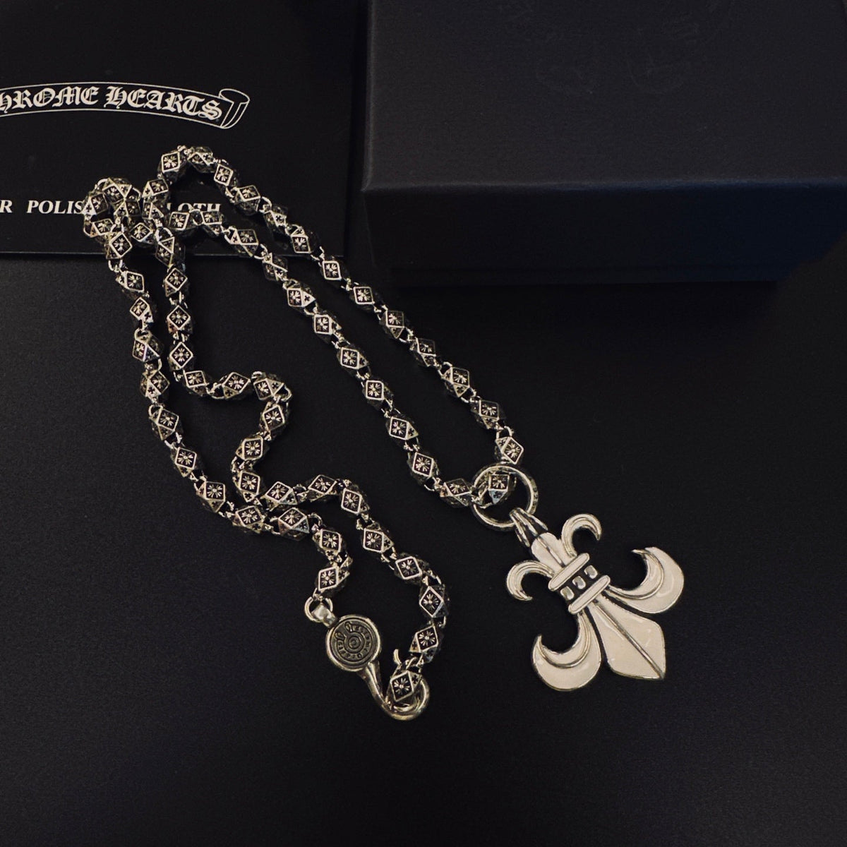 Martin Graham pendant necklace in polished metal-tone – side detail