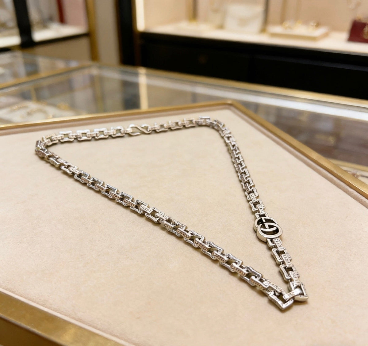 Martin Graham pendant necklace in polished metal-tone – side detail