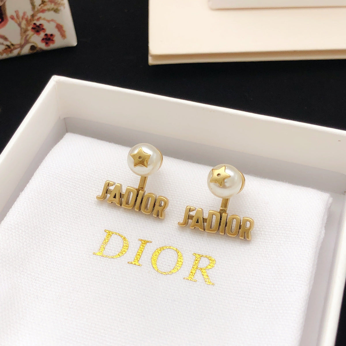 Martin Graham stud earrings in polished metal-tone – side detail