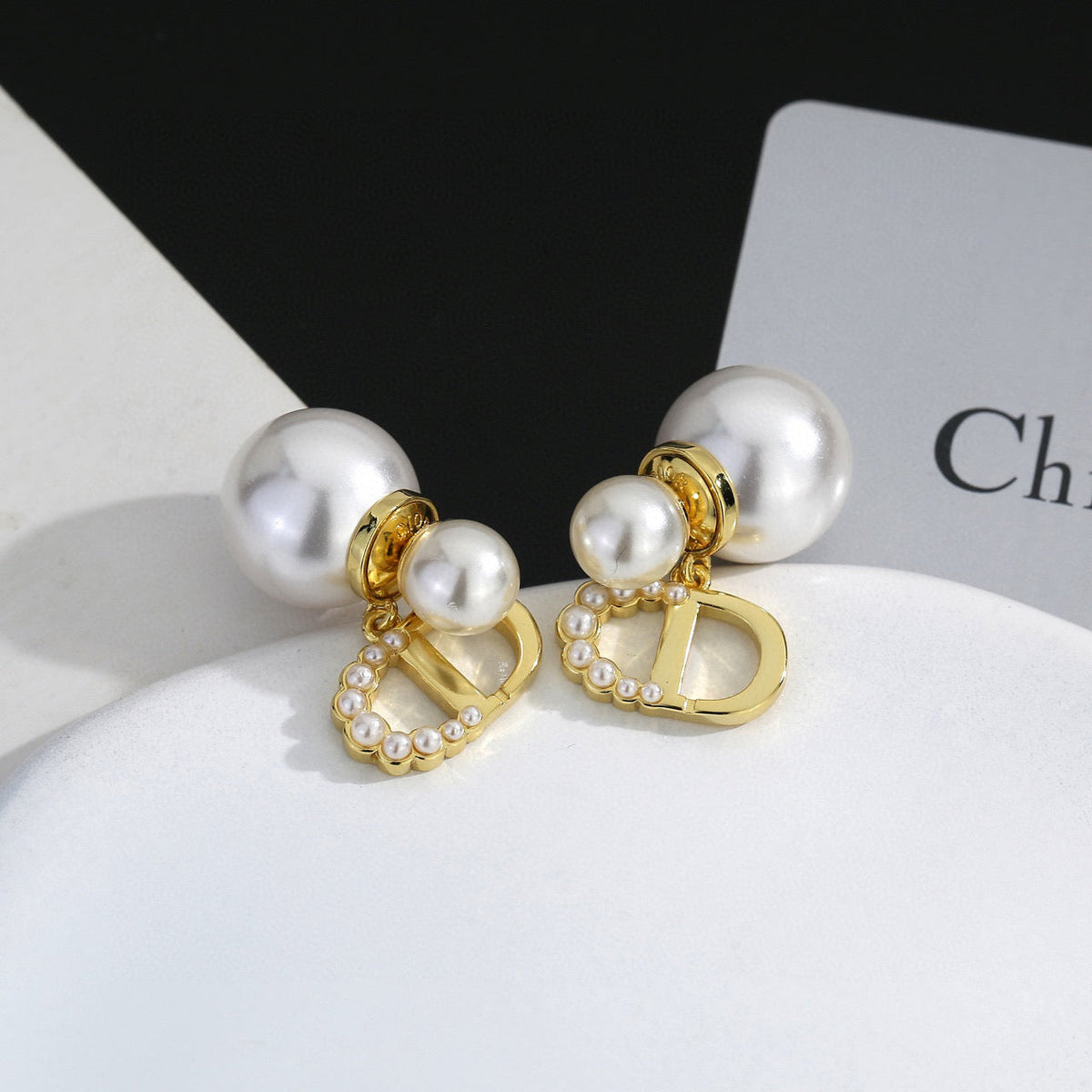 Martin Graham stud earrings in polished metal-tone – side detail