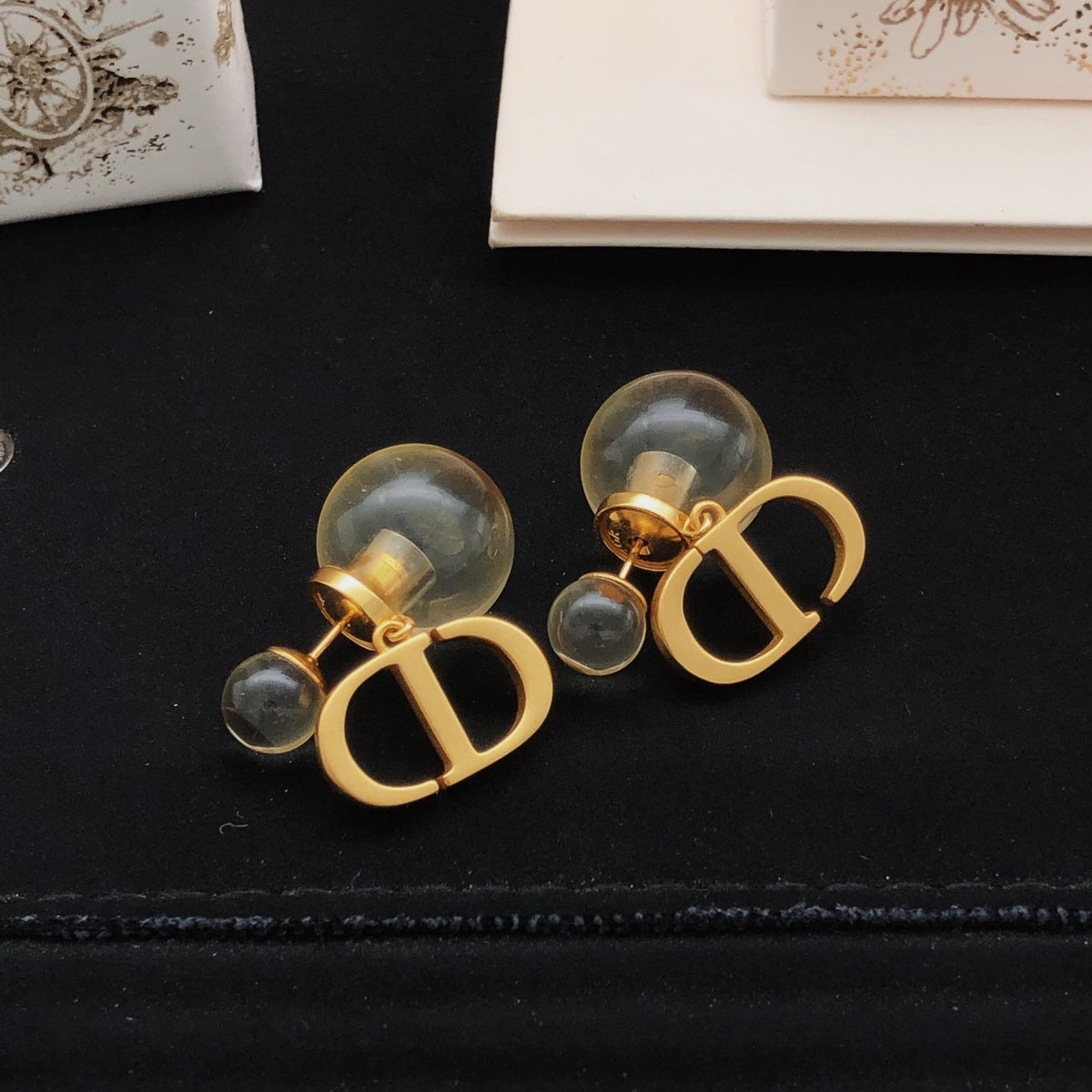 Martin Graham stud earrings in polished metal-tone – side detail