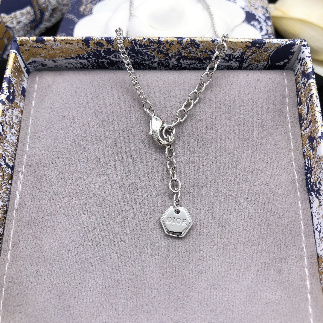 Martin Graham pendant necklace in polished metal-tone – side detail