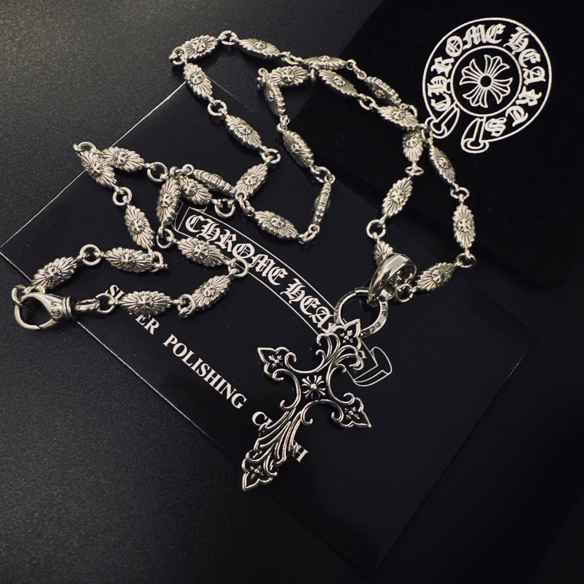 Martin Graham pendant necklace in polished metal-tone – side detail
