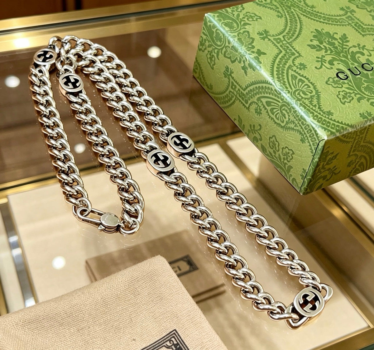 Martin Graham pendant necklace in polished metal-tone – close-up detail