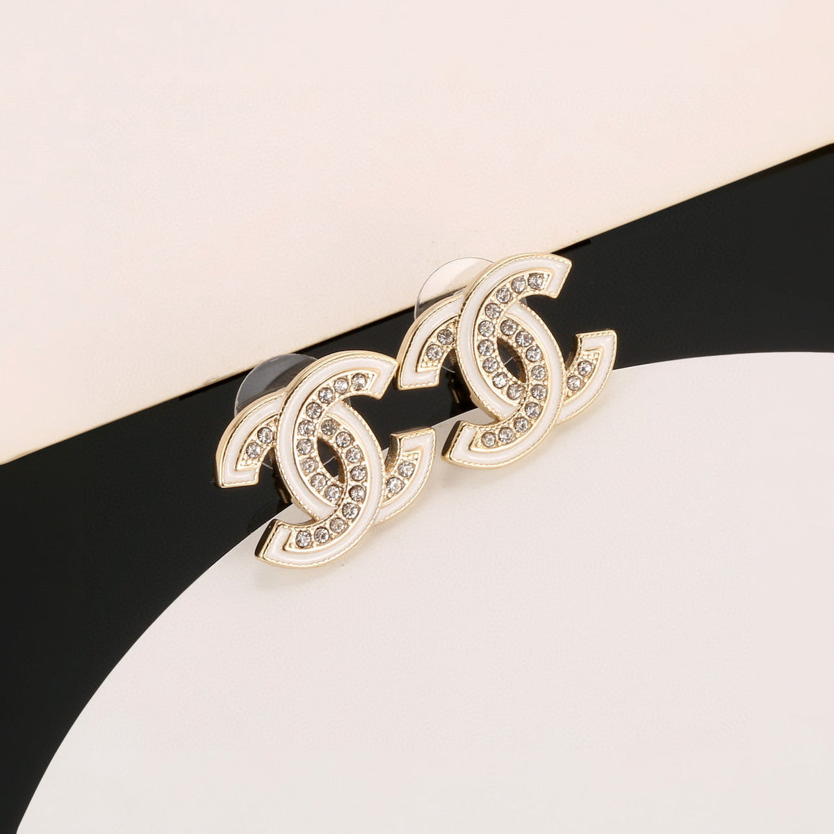 Martin Graham stud earrings in polished metal-tone – side detail