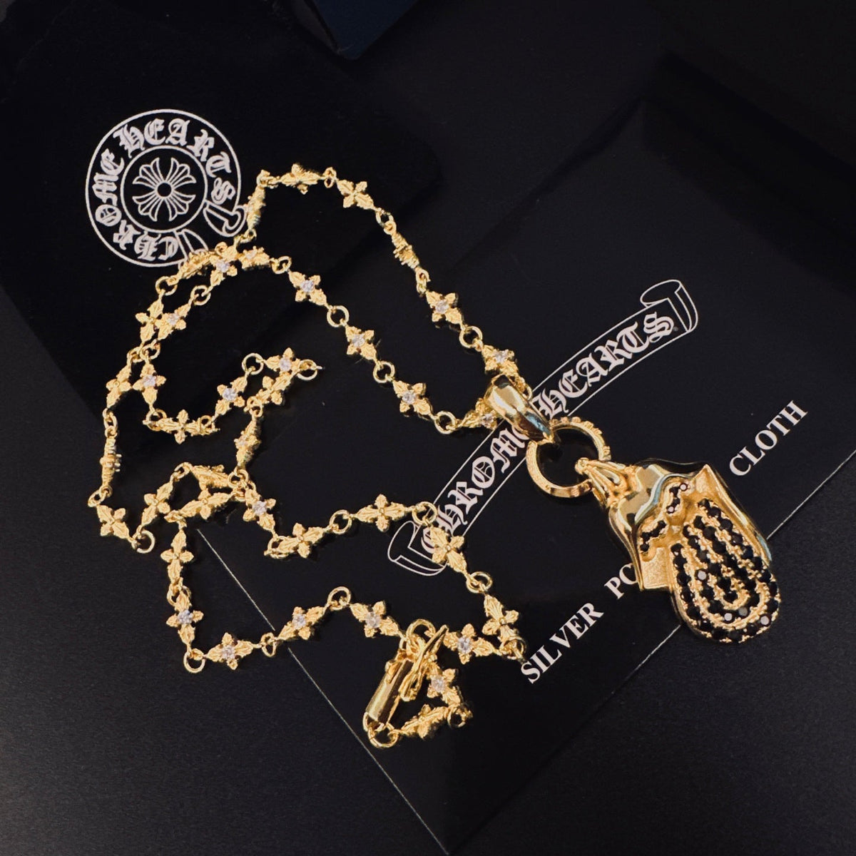 Martin Graham pendant necklace in polished metal-tone – side detail
