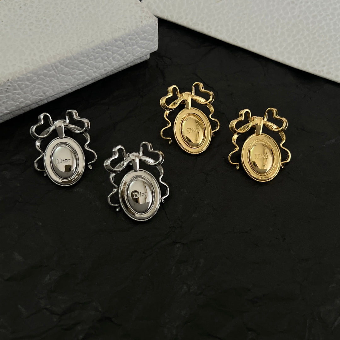 Martin Graham stud earrings in polished metal-tone – side detail