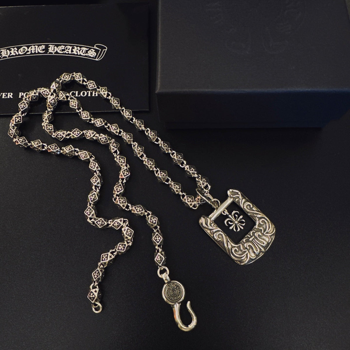 Martin Graham pendant necklace in polished metal-tone – side detail